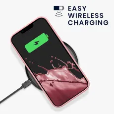 Wireless charging iPhone 14 with pink case intact on a charging pad