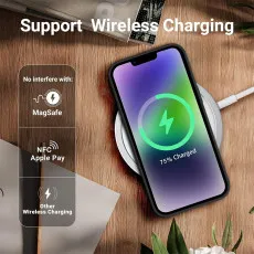 Wireless charging iPhone 14 Pro with black case placed on a charging pad