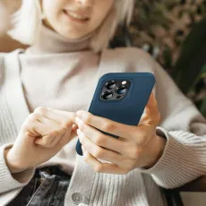 Ergonomic blue silicone case on iPhone 14 Pro Max showing slim design