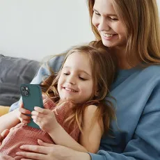 Non-slip grip on the green silicone case for secure handling of iPhone 15 Plus