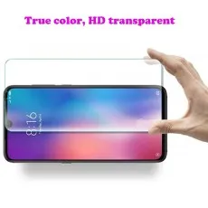 Hand holding a transparent tempered glass screen protector above a smartphone display.