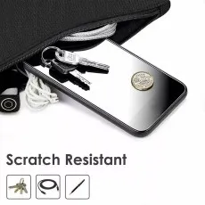 Scratch-resistant screen protector demonstrating durability against keys, coins, and other sharp objects in a bag.