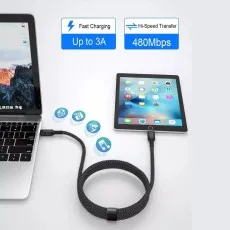 Type C to iPhone cable connected to a tablet and laptop demonstrating fast charging up to 3A and high-speed data transfer at 480Mbps
