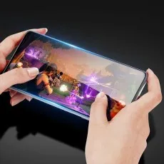 Honor 300 with tempered glass, showcasing smooth display and gaming performance in an action-packed shooting game.