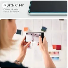 Crystal clear screen protector on a phone, ensuring an original display without blemishes, as seen while a person uses the phone to photograph color swatches.