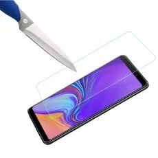 Knife testing screen protector on Samsung Galaxy A Quantum highlighting scratch resistance