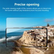 A smartphone displays a scenic coastal town on its screen, highlighting a Precise opening for the camera