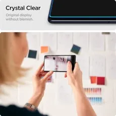Crystal Clear protector original, blemish-free phone display. Person views screen clearly