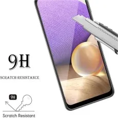 Smartphone screen protector being scratched by a utility knife, showing 9H resistance