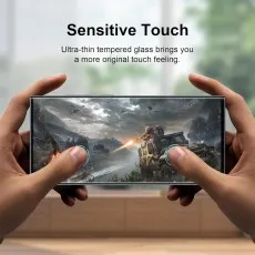 Sensitive touch screen protector shown during mobile gaming. Anti-fingerprint, bubble-free, scratch-resistan