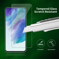 Utility knife scratching a Tempered Glass Scratch Resistant screen protector on a Samsung S25 Plus