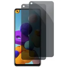 Galaxy A21s with a privacy screen protector partially applied and a spare one beside it.
