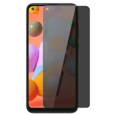 Galaxy A11 with a privacy screen protector partially applied and a spare one beside it.