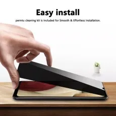 Hand applying a screen protector for easy installation on a Galaxy phone
