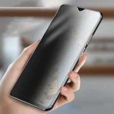 Hand holding a Vivo phone with a privacy screen, showing darkened edges