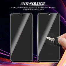 ANTI-SCRATCH tempered glass for Vivo (likely). Key scratching one protector; the other is pristine