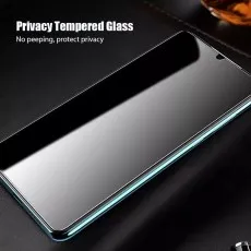 Privacy tempered glass screen protector on a smartphone, dark screen visible.