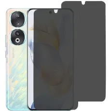 Honor 90 with 2 privacy screen protector partially applied, with two spares beside it.
