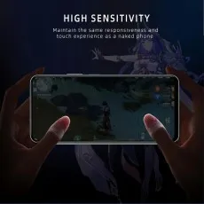 High sensitivity screen protector maintains responsiveness for gaming. Hands playing Genshin Impact on a phone.