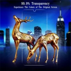 Two golden deer statues in front of a city skyline, with a transparent screen protector overlay