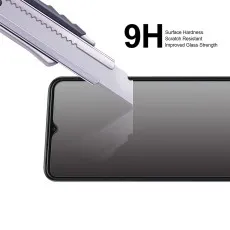Screen protector resisting scratches from a utility knife, highlighting 9H hardness