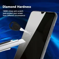 A phone screen with a key and a utility knife demonstrating its diamond hardness and anti-scratch properties