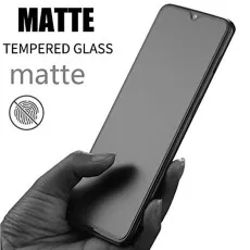 A hand holds a smartphone with a matte tempered glass screen protector, next to text indicating its finish