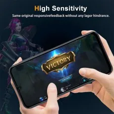 A smartphone displays a Victory screen from a mobile game, with hands holding the device