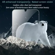 A polar bear is walking on a snowy mountain, with a transparent screen protector placed on top