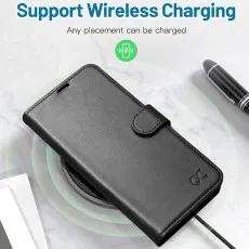 Samsung Galaxy S23 FE black leather wallet case placed on a wireless charger, highlighting full wireless charging support without removing the case