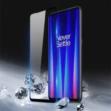 9D glass screen protector next to Moto G Stylus phone.