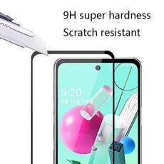 Craft knife poised over a smartphone screen protector, emphasizing 9H hardness