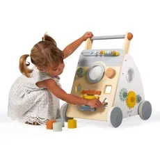 A lifestyle shot of the wooden baby walker, showing a child engaging with its many fun features.