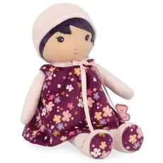 A plush Kaloo doll with a purple floral dress, a pink bow, and matching shoes, sitting