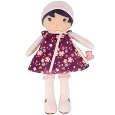 A standing plush Kaloo doll with a purple floral dress, a pink bow, and matching leg warmers