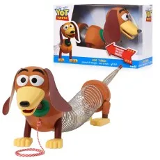 A Slinky Dog toy from Toy Story with its head turned to the side, next to its open box