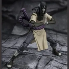 A collectible Orochimaru figure performing a jutsu hand sign with a sinister smile.