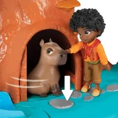 A detailed shot of the Antonio figure petting a capybara next to the tree base of the playset.