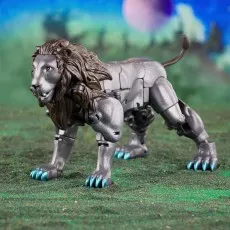 A Transformer toy of Leo Prime in its metallic lion form, with blue claws, posed on a grassy field