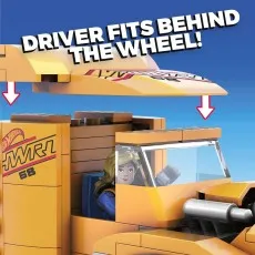 A close-up of the Mega Construx Hot Wheels truck, showing a figure placed in the driver's seat.