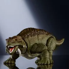 A Jurassic World Hammond Collection Scutosaurus figure is poised with its mouth open on a reflective surface.