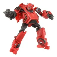 A red robot action figure with horns, holding a large gray blaster gun in its right hand.