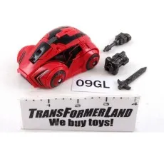 A red toy car with two black weapon accessories and a sword accessory.