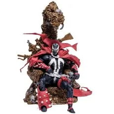 A Spawn action figure sits on a large throne made of skulls and bones, wearing a red cape