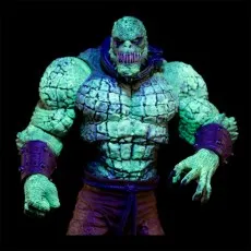 A glowing Killer Croc action figure is shown against a dark background, its scaly skin and muscular body highlighted