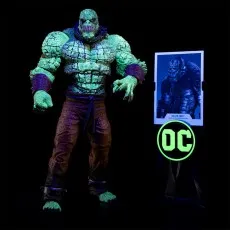 A glow-in-the-dark Killer Croc action figure is shown with a glowing character card against a dark background