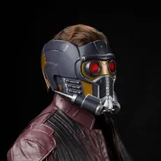 A person wearing a red leather jacket models the Star-Lord Electronic Helmet
