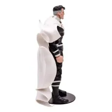 A side view of the Justice Lord Superman action figure, showcasing his black and white suit and flowing white cape