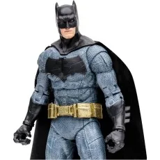 A close-up shot of a highly detailed Batman action figure wearing a gray suit, gold belt, and black cape.