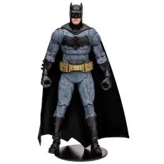 A collectible Batman toy in a neutral pose, with a gray textured suit and a black bat symbol.